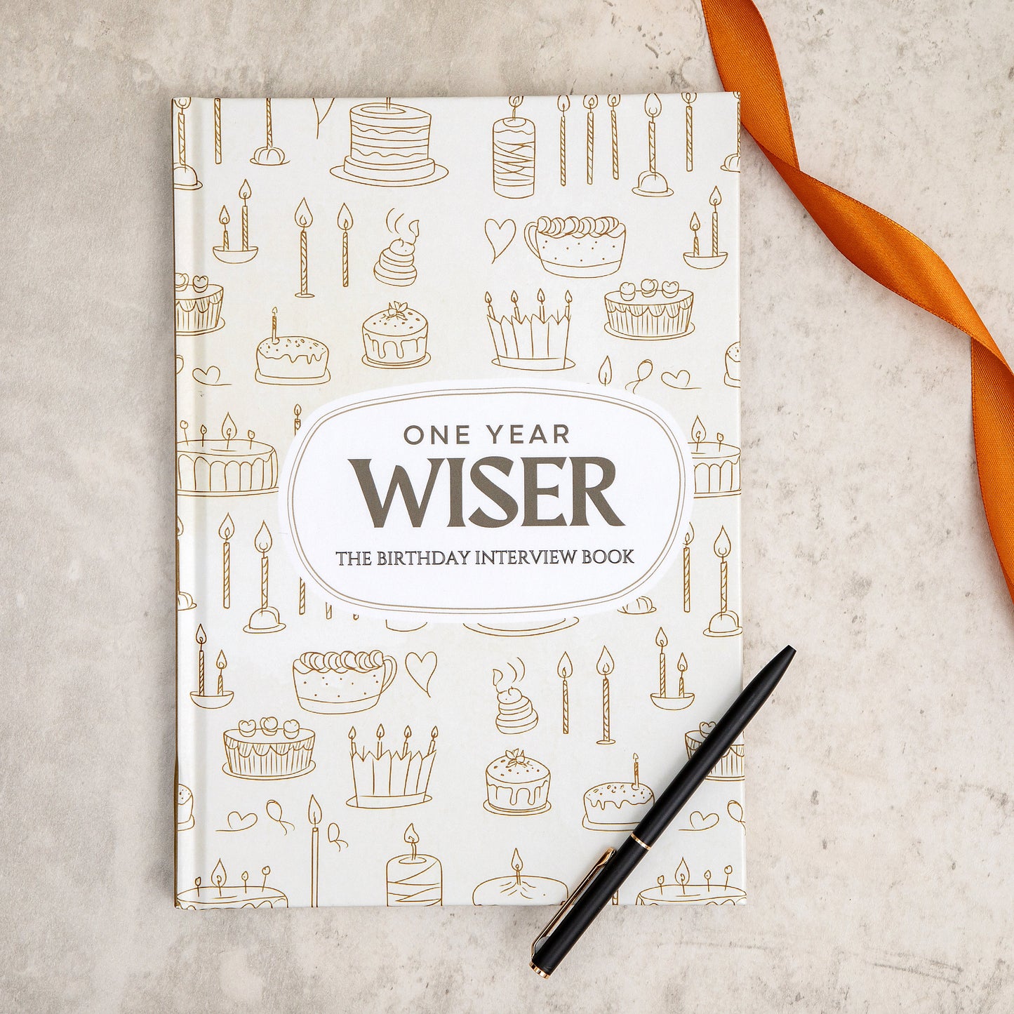 The front page of one year wiser the birthday interview book by EMF publishing