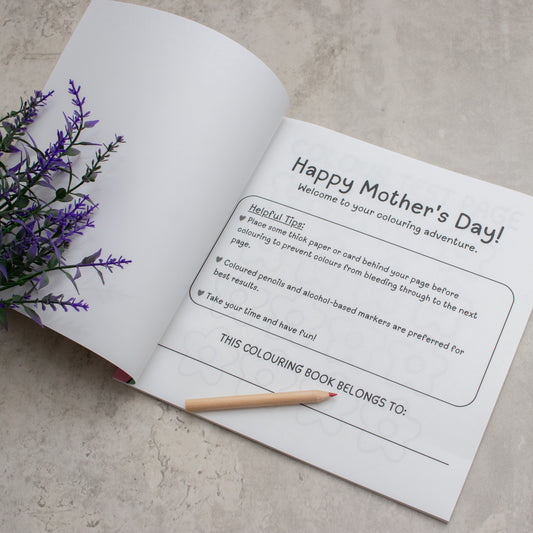 The first page inside Mom's day off colouring book that reads Happy Mother's day. A perfect gift designed by EMF publishing, creators of 99 dates to remember. 